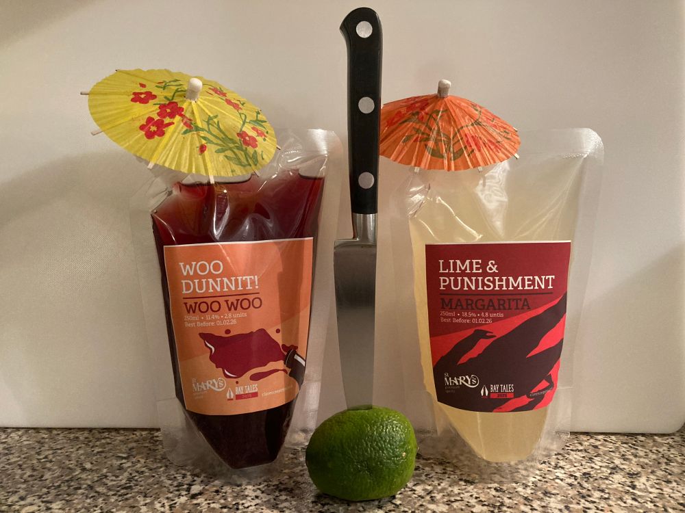 Picture of two packets containing alcoholic cocktails with a knife stabbing a lime. 