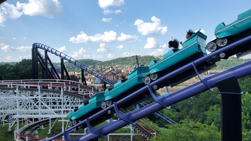 Phantom's Revenge roller coaster coasting over a hill.