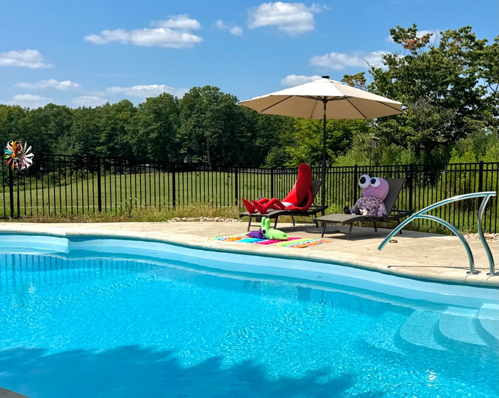 allan, pim, and glep sitting by the pool