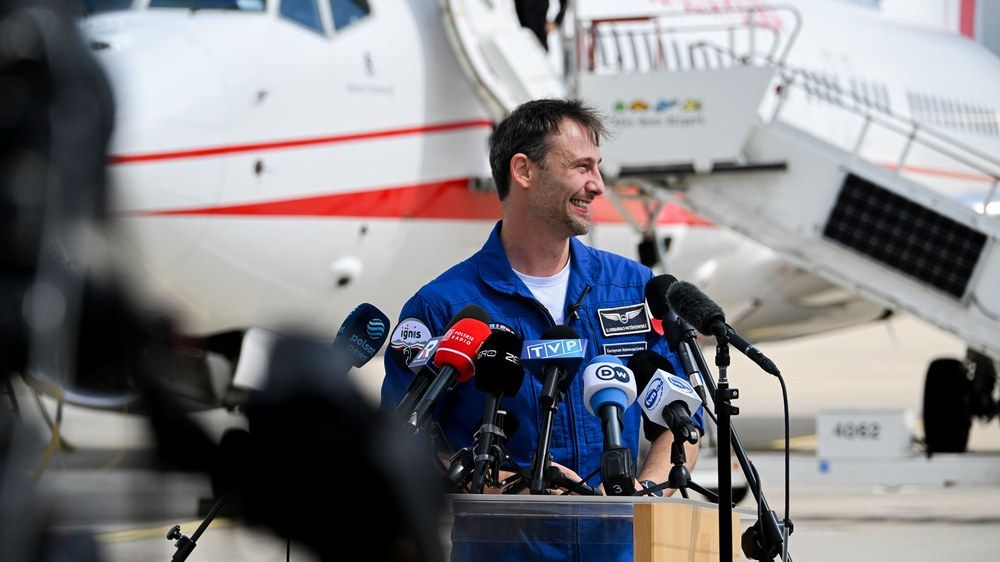 Sławosz Uznański-Wiśniewski speaking at a press conference after arriving in Cologne.