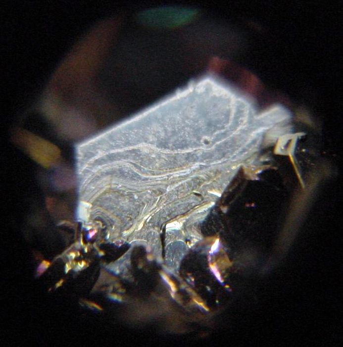 Grey cristal of moisssanite seen under 14x magnification, from the Mineral Collection of Brigham Young University Department of Geology, Provo, Utah.