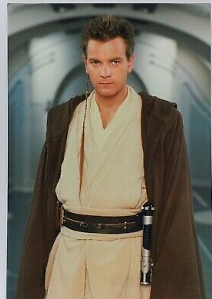 Ewan McGregor as Obi-One Kenobi in star wars, standing and looking at the camera. 