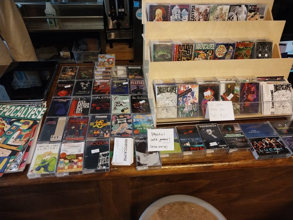 A bar covered in cassette cases with indie games on usb in them