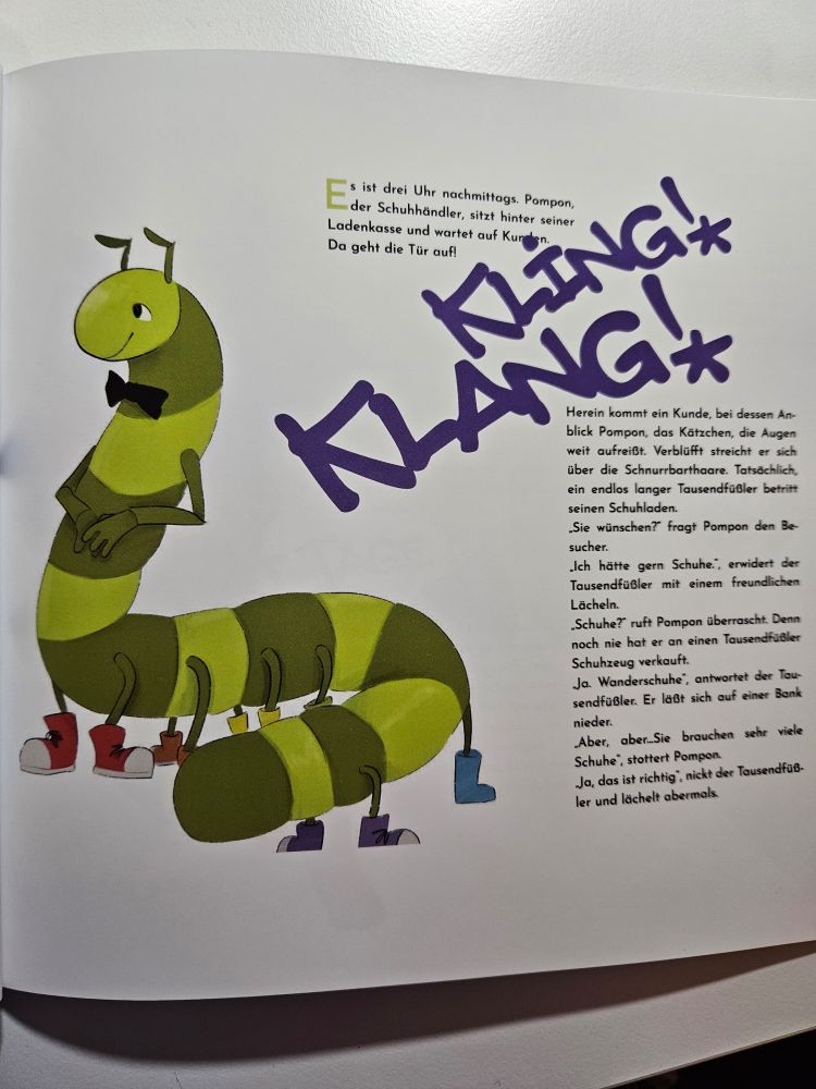 A page of a book.
There are two blocks of text on the right. A smaller one on the top and a larger one beneath. They are separated by large purple letter that read "Kling! Klang!".
There is an illustration of a cartoonish green millipede on the left. He is wearing a dark blue bow tie and six pairs of shoes, each pair in one of the colors of the rainbow.