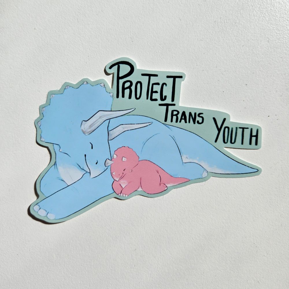 A sticker of a light blue triceratops laying next to a light pink baby with "Protect Trans Youth" written above them.