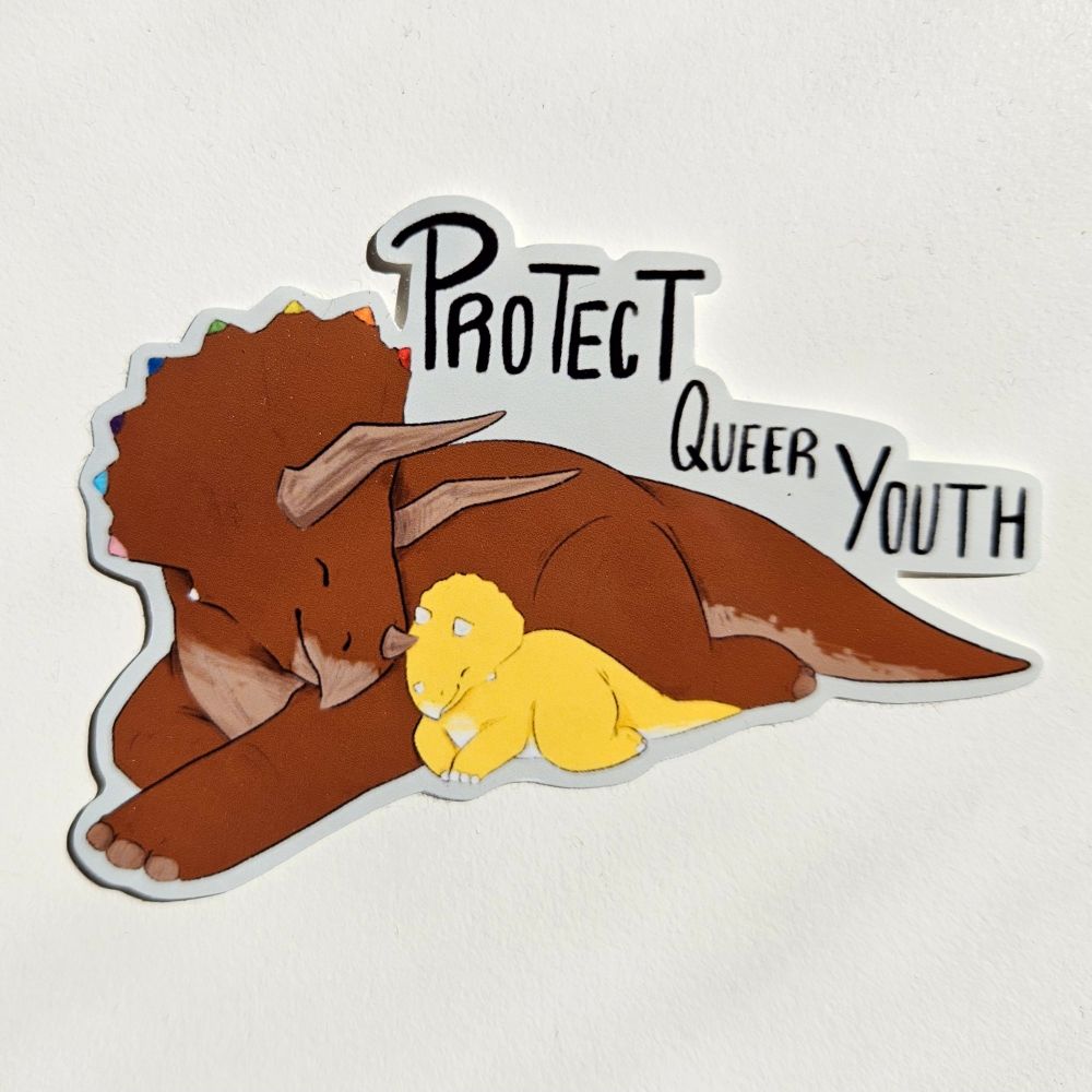 A sticker of a brown triceratops with rainbow accents laying next to a yellow baby with "Protect Queer Youth" written above them.