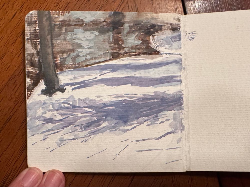 Plein air painting sketch of snowy mountains by a creek