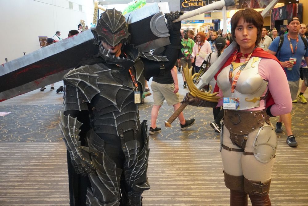 Cosplay of Guts and some other lady from berserk idk I haven’t read the thing don’t yell at me