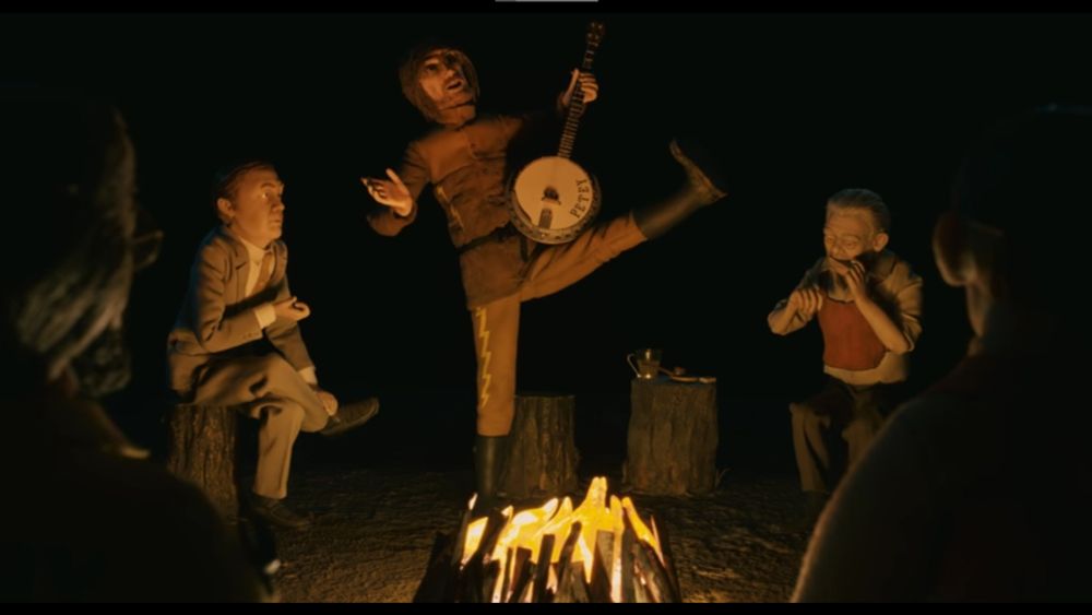 [fantastic mr. fox] petey bangin out the tunes on a banjo around a campfire