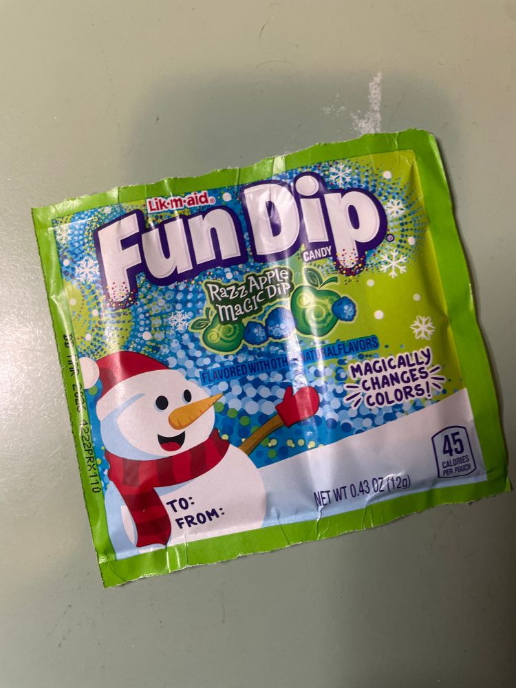 modern day christmas-themed fun dip package, with a single flavor packet and single lik-a-stix