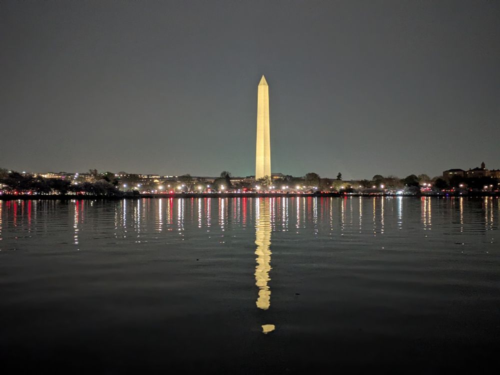 Night Sight photo of the Washington Monument and surrounding skyline from the far side of the Tidal Basin.