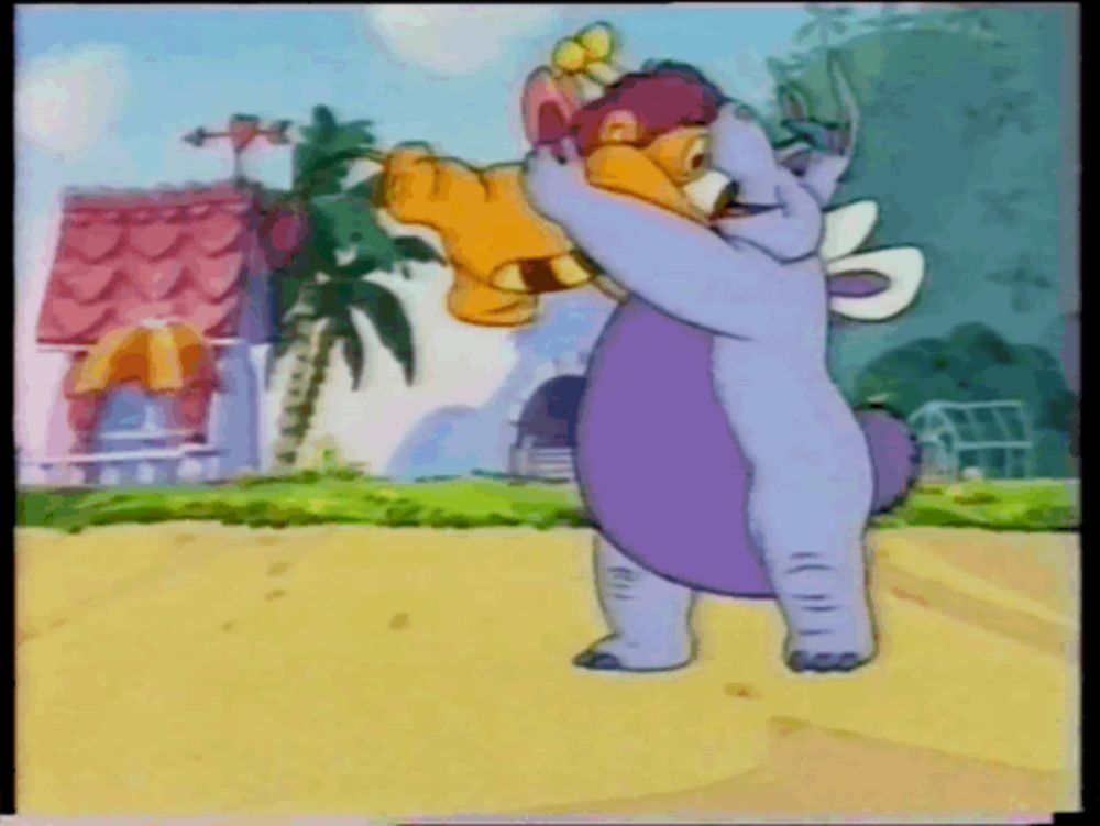 a cartoon elephant is holding a stuffed animal in his arms