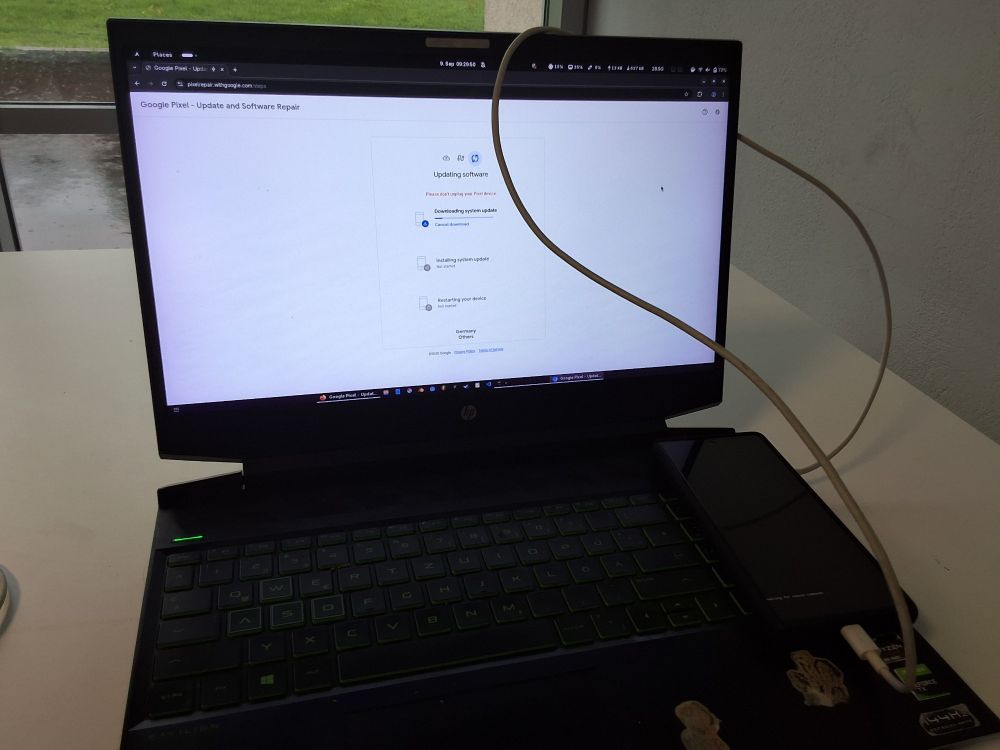picture of a laptop connected to a phone, the laptop has the pixel repair web tool open, the pixel is displaying the text waiting for rescue commands