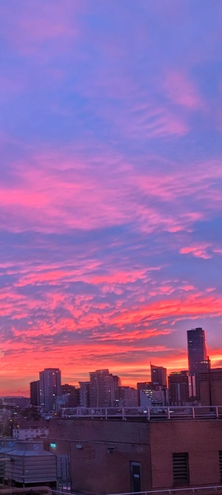 Brilliant blue, orange and pink sunrise over Melbourne city 