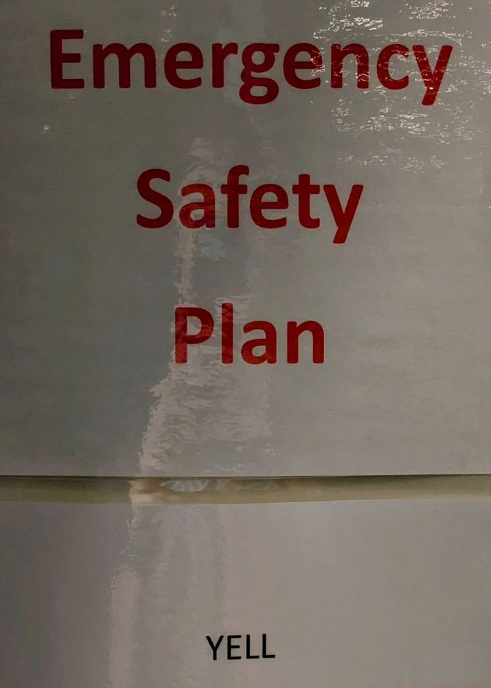 A sign that says, "Emergency Safety Plan: Yell."