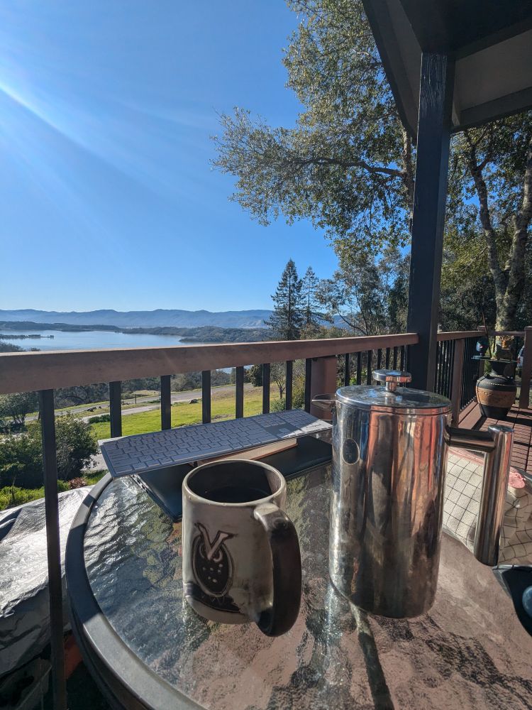 Outside office in the California sun
French press coffee, laptop & a stunning view of Lake Mendocino 
