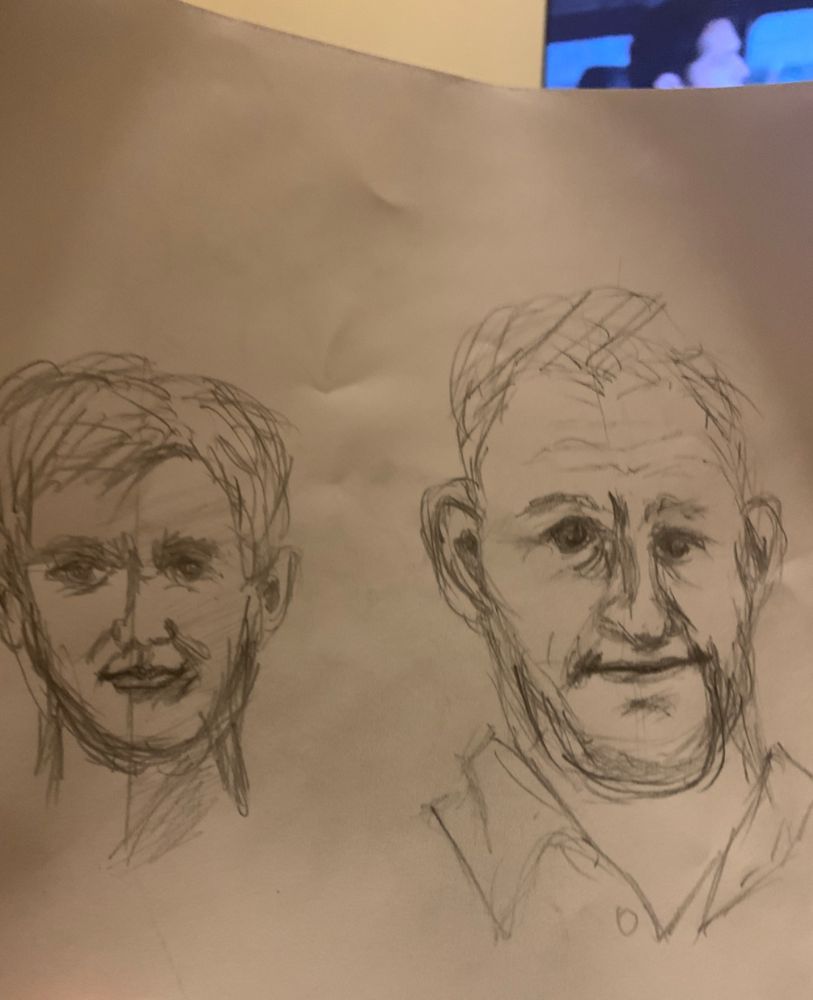 Sketches of two men's faces. 