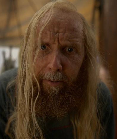 Buttons, from Our Flag Means Death, looks into the camera and peers into your soul.