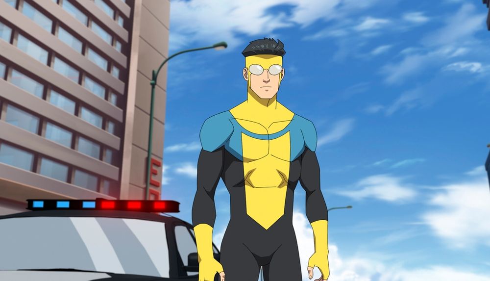 neon yellow and teal superhero guy with geometric jaw shape over uncomfortably-close-to-the-teal blue sky with a gray ass boring gray building off to the side
