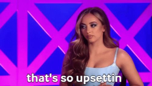 Jade Thirlwall guest hosting on RuPaul’s Drag Race UK, shaking her head and saying “that’s so upsettin”
