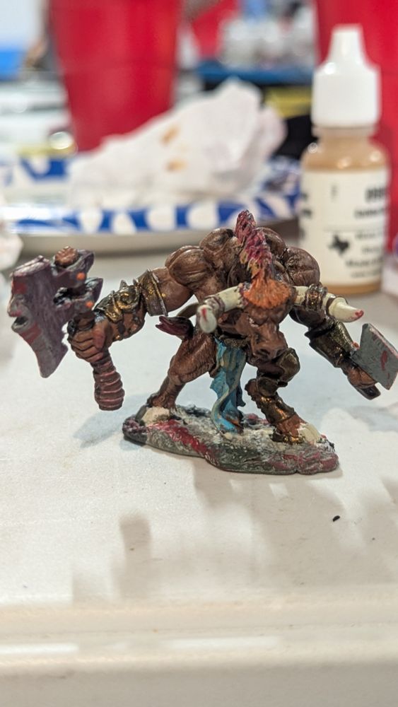 A hand painted miniature Minotaur who goes by Mr. Peanutbutter 