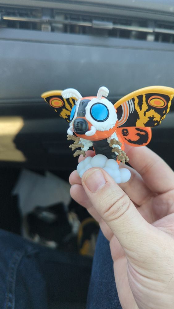 A small mothra figurine from a Godzilla Blind Box