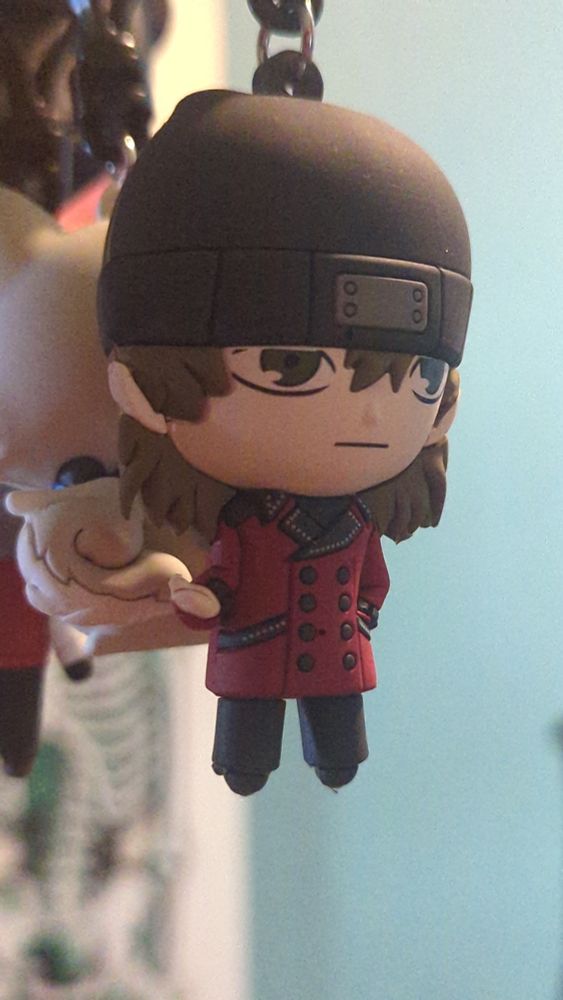 A mini figure of Shinjiro from Persona 3.