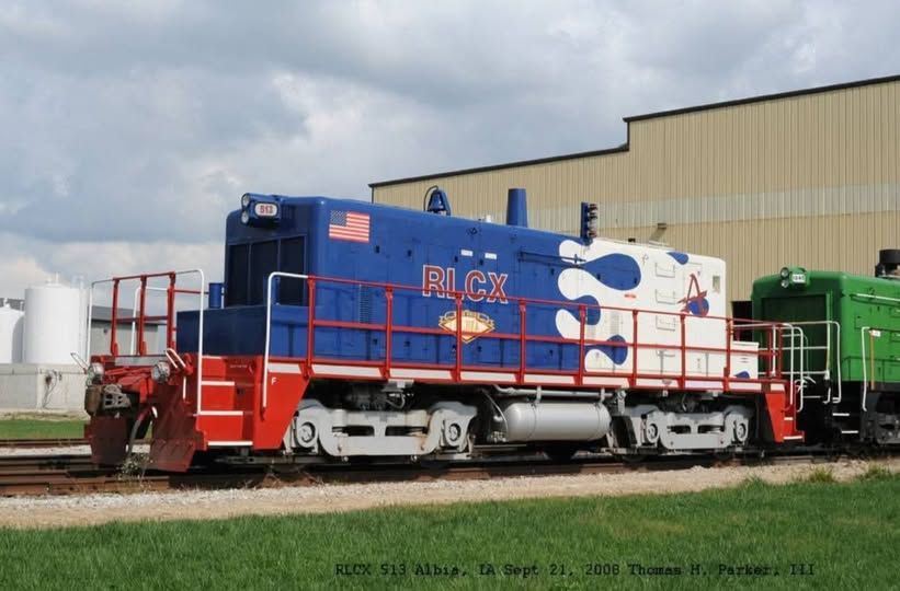 A cabless SW1 rebuilt into an "SW18" by RELCO. Either a slug or a powered "calf" (most likely the latter since it has an exhaust stack" painted in hot-rod flames, but they're white, and it's blobby...and that has me concerned. 
