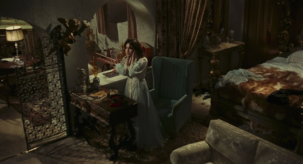 Still from The Telephone, with Rosy looking around her home after receiving one in a series of disturbing phone calls.