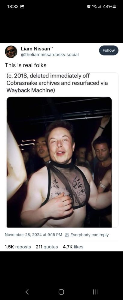 An old picture of Elon Musk wearing a mesh, see through top and appearing to be under the influence of mind altering substance in a nightclub, surrounded by a large group of other men. 