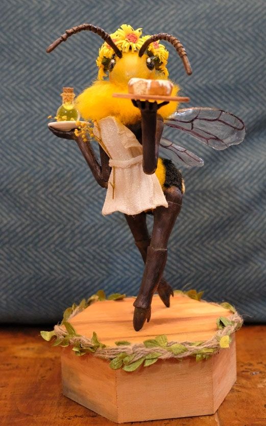 Sculpture of a bee waitress