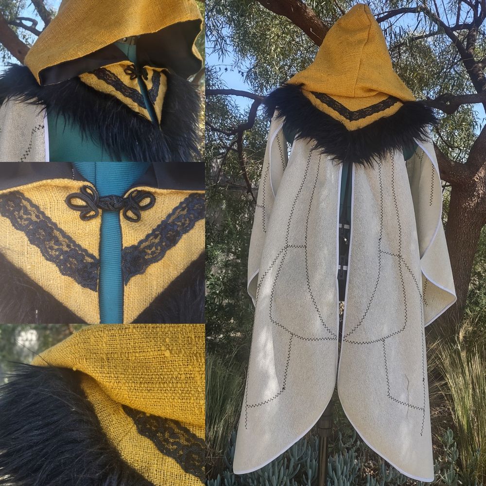 Bee inspired cape. Yellow linen makes up the top half. Lace and faux are used to make the stripes. White linen makes up the wings. Wings have black stitches embroidered on them to look like the lines of bumblebee wings.