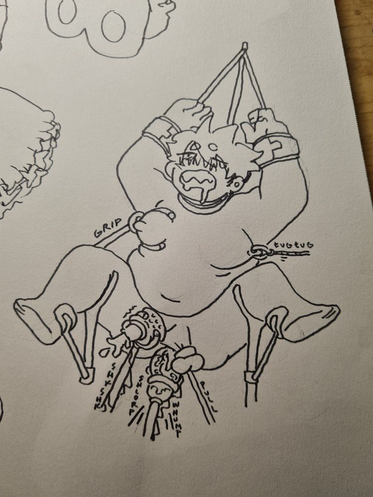 photograph of a lined drawing. Hana gets fucked by said fuck machine. his hands are held over his head and various arms poke and prod at him. he's blissed out. 