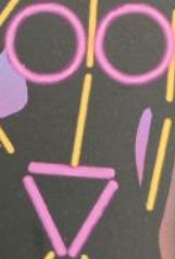 A zoom-in on the torso of the above image, with the shapes of the glowsticks making it look like an incredibly stupid face.