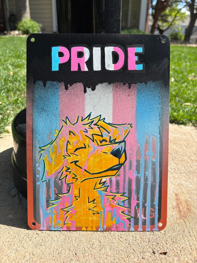 Trans pride flag art of a golden retriever and some cool fun drips! I used a lot of different acrylic paint mediums to make this piece on a metal sign! Furry art for pride month!