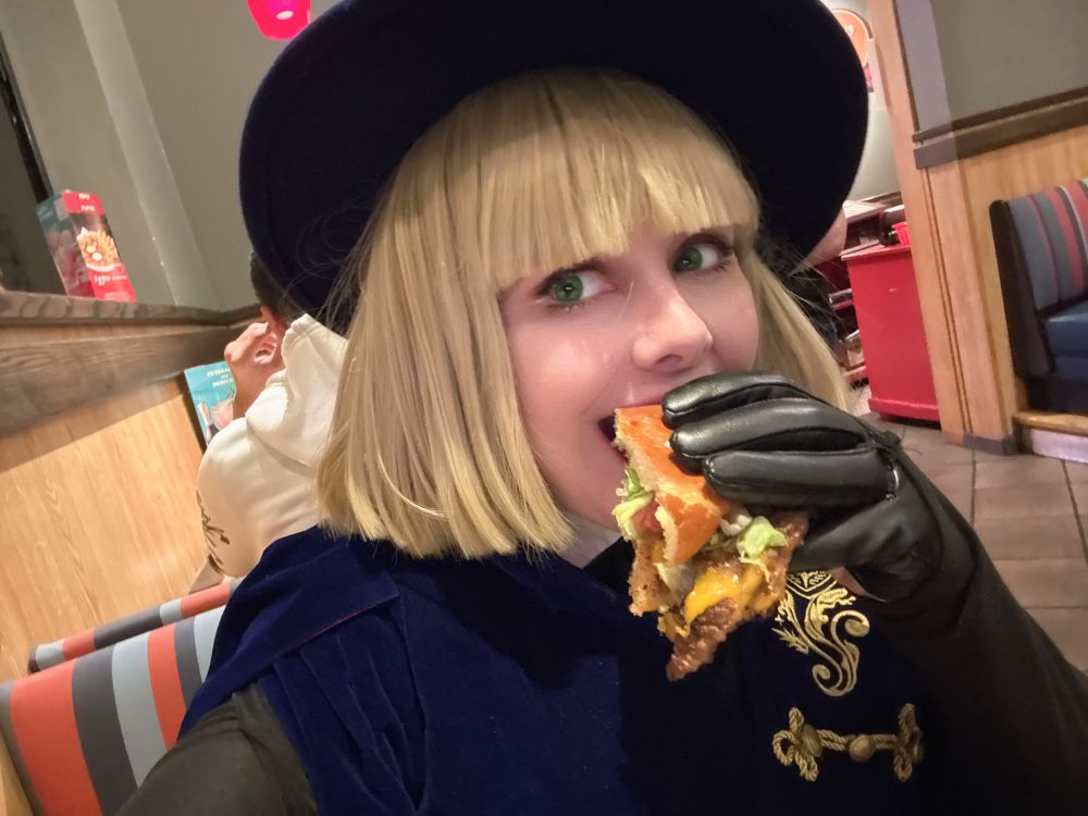 Me as Rook from Twisted Wonderland eating a burger