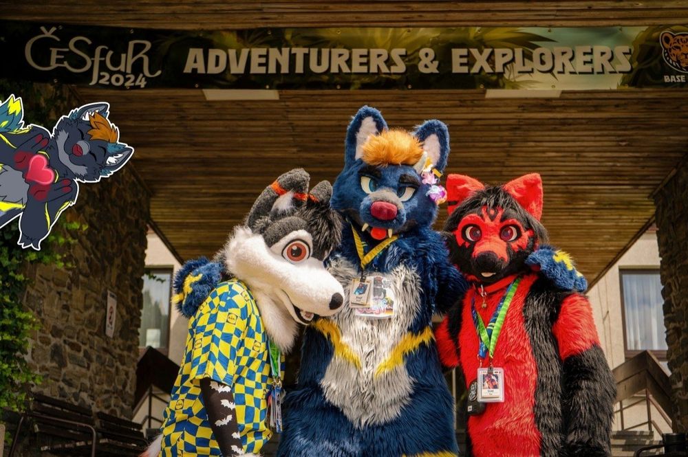 A picture of three Fursuiters.
SEBY on the left, a white and grey Husky
ICAN on the right, a red and black Fox
ME in the middle.
Standing in the front entrance of ČeSFuR Hotel Skalský Dvůr.