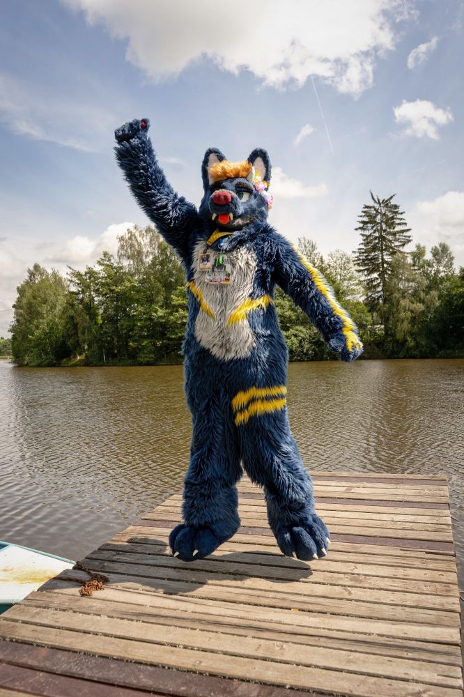 A picture of me in suit on a lakepiere mid jump.