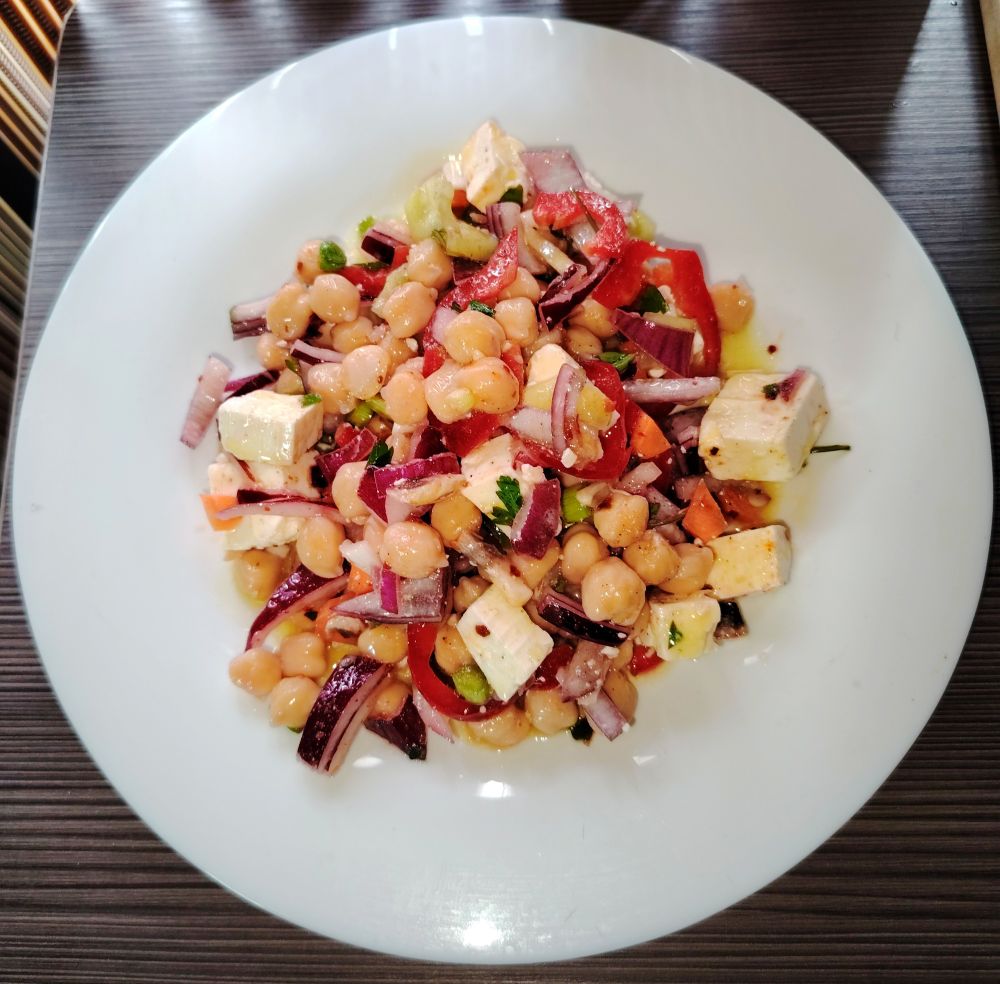 A white plate consisting of Chickpea Salad