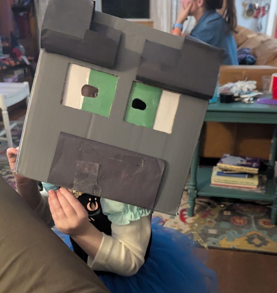 Toddler wearing a Minecraft mask