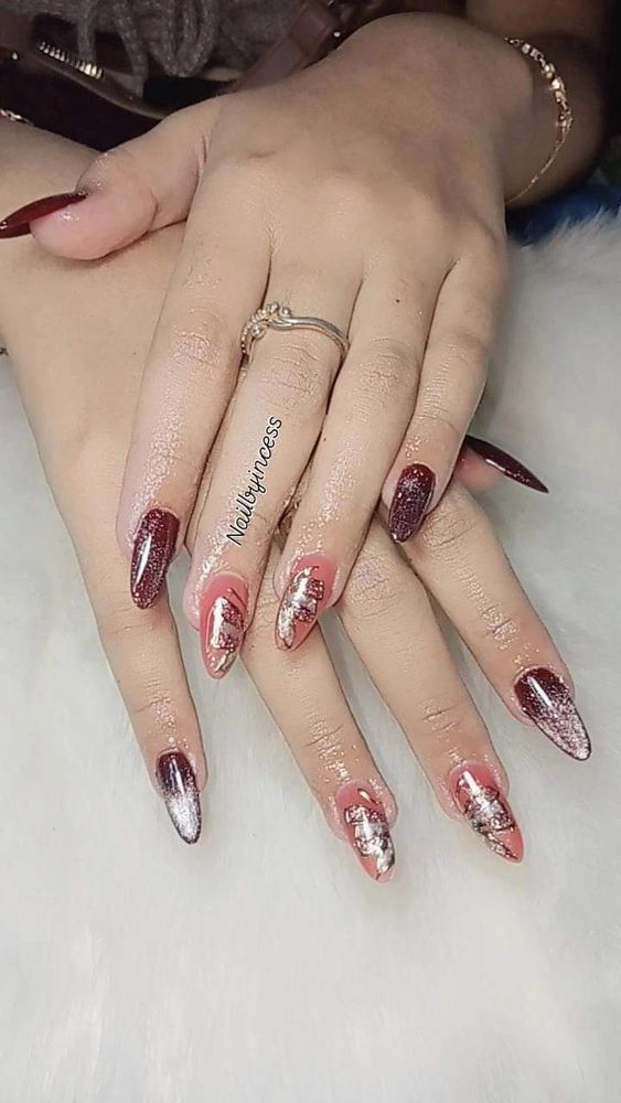 Glitter tips add a sparkling finish to this beautiful ombre mani.