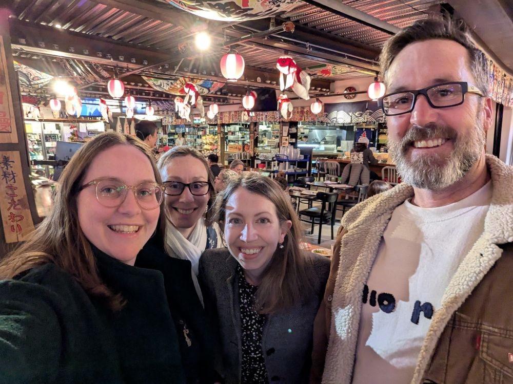 4 smiling research scientists