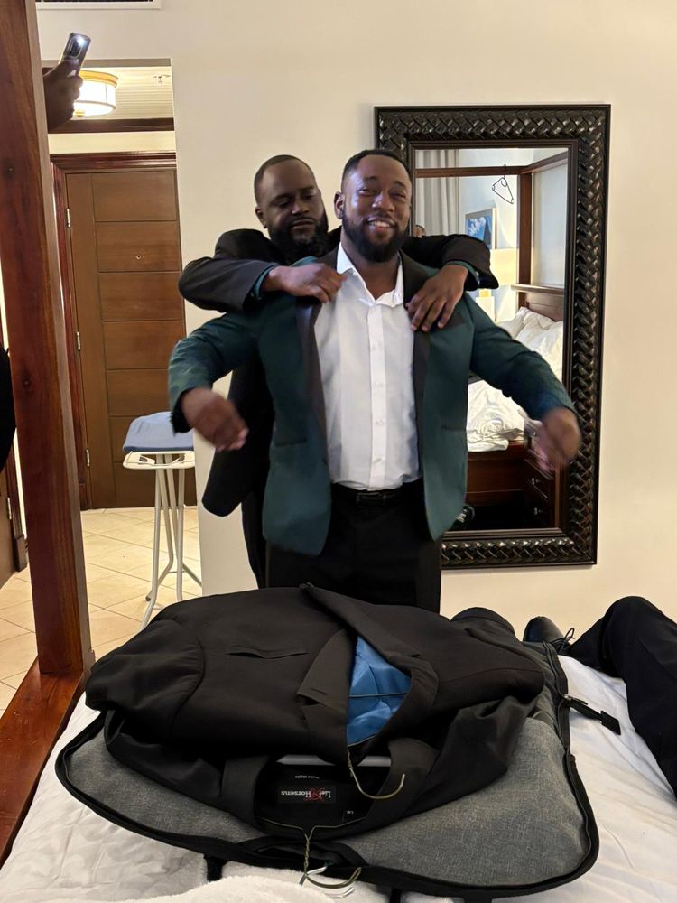 KC getting dressed for the wedding ceremony with the help of his Best Man Chris aka Snicks360