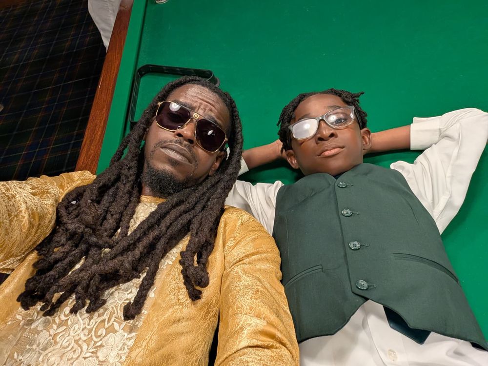 Starboy and Mike P. lounging on a pool table.