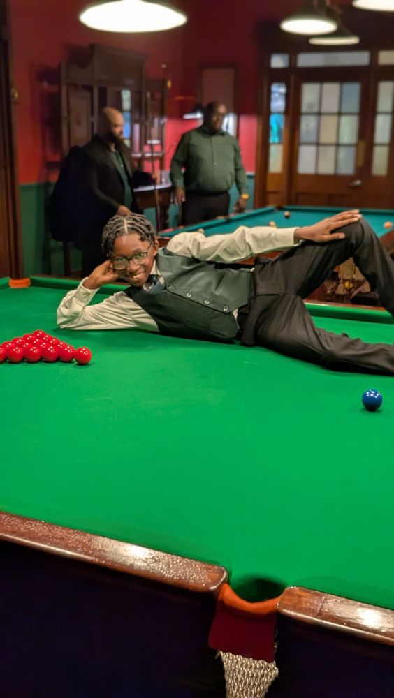 Starboy recreating the Thriller album cover on a pool table.