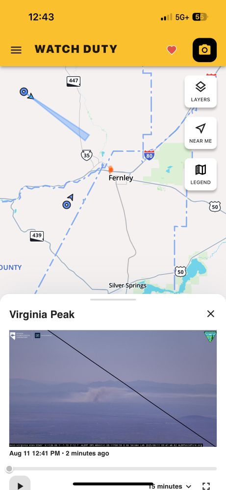 Watch duty screenshot showing satellite indicated fire between Fernley and wadsworth NV, with a camera view from many miles away showing a plume of smoke