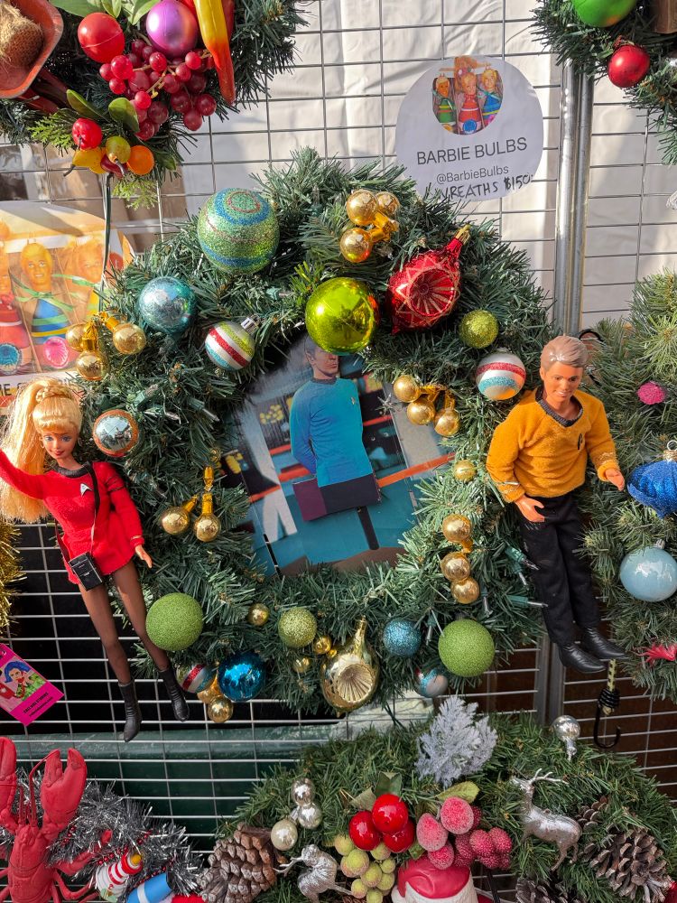 A Christmas wreath with Barbie dolls dressed in Star Trek The Original Series uniforms.