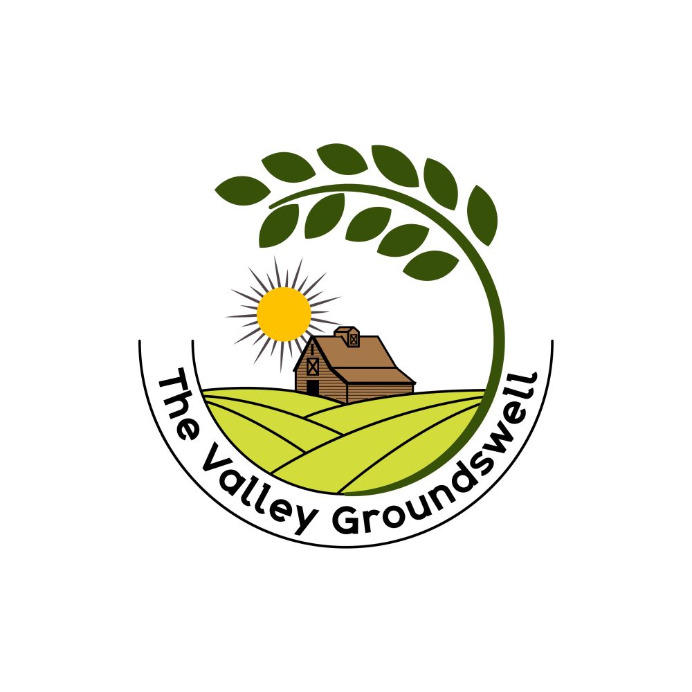 Round logo featuring a farm field, barn, and sun encircled by a plant leaf and the words "The Valley Groundswell".