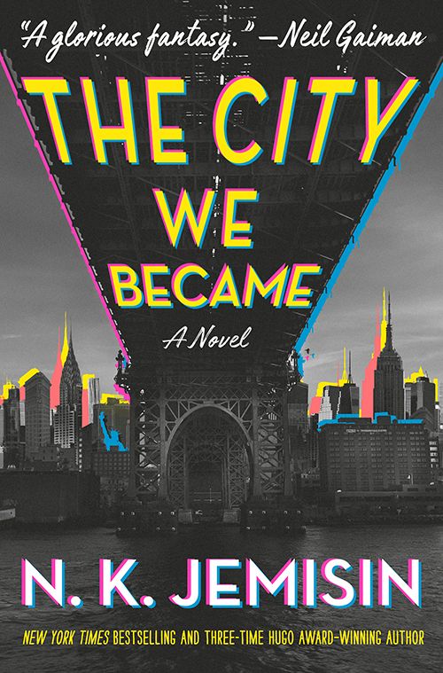 Cover art for N.K. Jemisin’s “The City We Became”. A dark cityscape with highlights in bright yellow, pink, and blue against a grey background.
