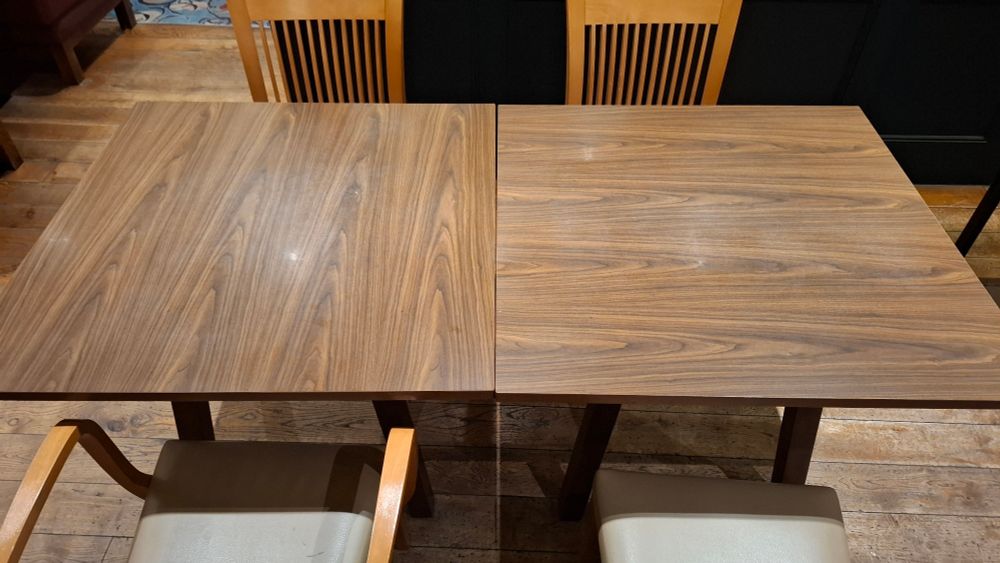 Two tables, the wood grain on one is rotated 90 degrees to the other. 
